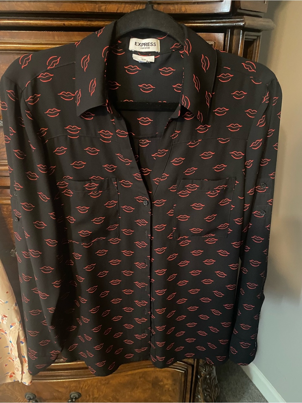 Express portofino red lips on black blouse